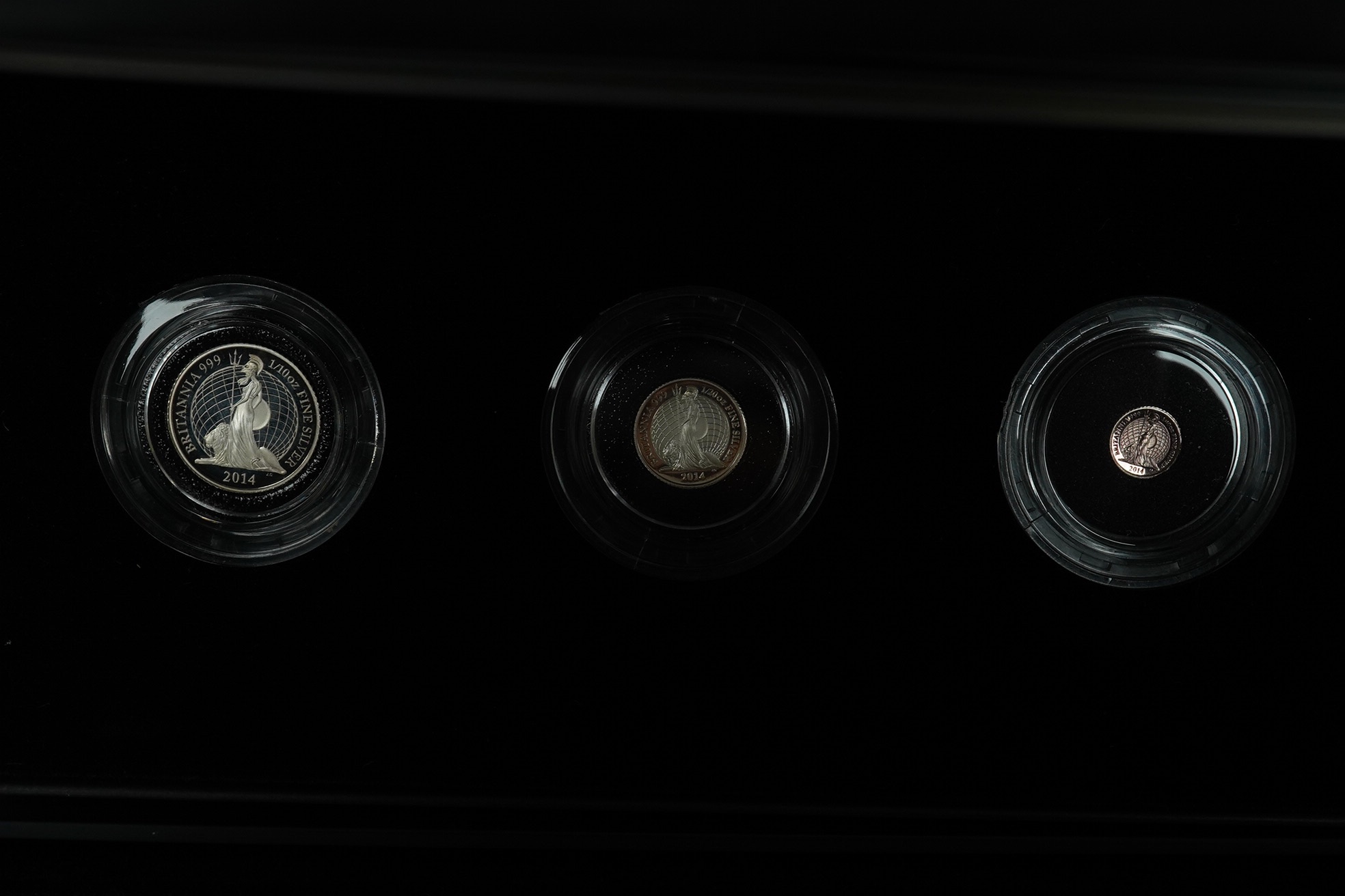 Royal Mint UK QEII proof coins, three Britannia four-coin silver proof sets, 2008, 2009 and 2011 and a Britannia collection three-coin silver proof set 2014, in 4 cases of issue with certificates